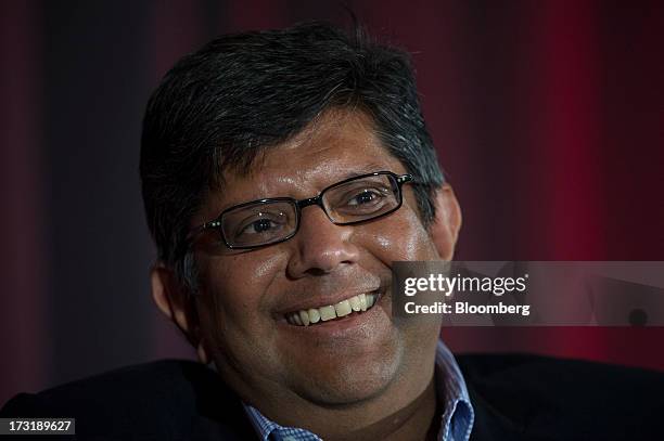 Anand Chandrasekher, chief marketing officer of Qualcomm Inc., smiles during the MobileBeat Conference in San Francisco, California, U.S., on...