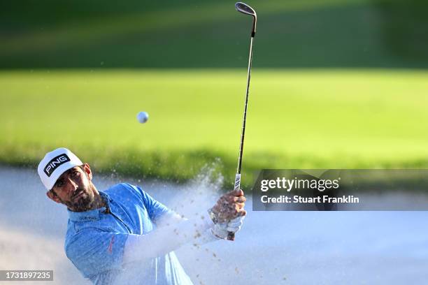 Matthieu Pavon of France plays out of a bunker on the 18th hole on Day One of the acciona Open de Espana presented by Madrid at Club de Campo Villa...