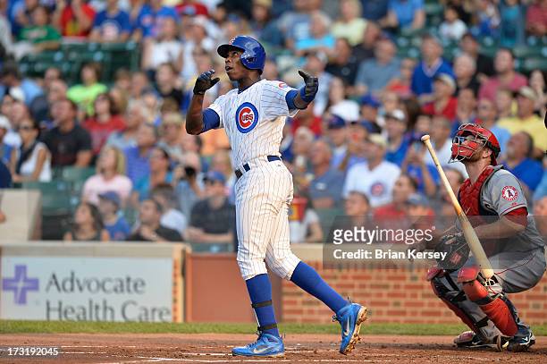 Alfonso Soriano of the Chicago Cubs and catcher Chris Iannetta of the Los Angeles Angels of Anaheim watch Soriano's solo home run during the first...