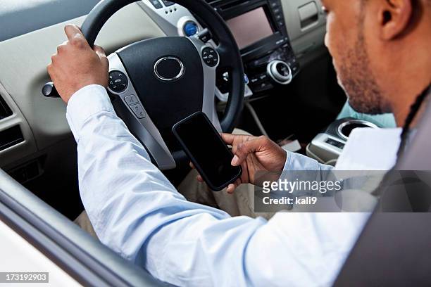 driver using mobile phone - mobile phone in hand driving stock pictures, royalty-free photos & images