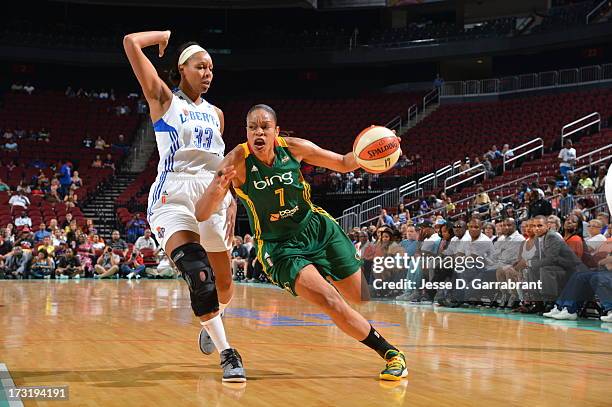 Tina Thompson of the Seattle Storm drives to the basket against Plenette Pierson of the New York Liberty during the game on July 9, 2013 at...