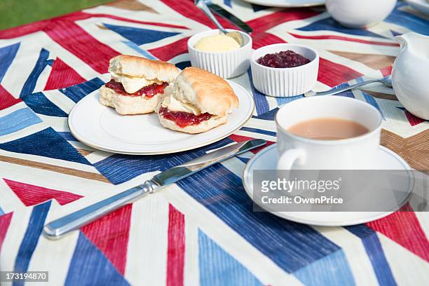 traditional english tea on patriotic tablecloth - british culture stock pictures, royalty-free photos & images