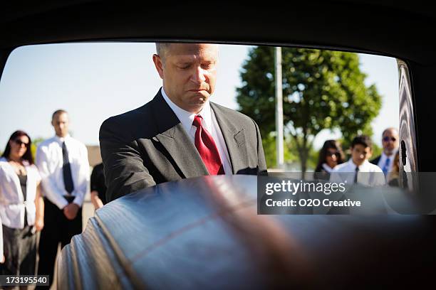 grieving man - car mortuary stock pictures, royalty-free photos & images