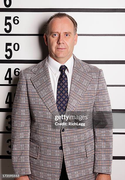 mugshot of a businessman - police line up stock pictures, royalty-free photos & images