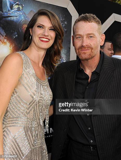 Actors Heather Doerksen and Max Martini arrive at the premiere of Warner Bros. Pictures' and Legendary Pictures' "Pacific Rim" at Dolby Theatre on...