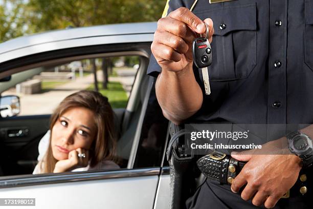 police officer taking keys from driver - drivers license stock pictures, royalty-free photos & images