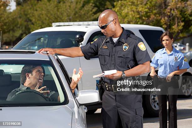 driver mad at citation - ticket stock pictures, royalty-free photos & images