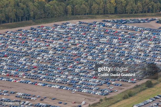 In an aerial view, unsold cars parked on the old Bruntingthorpe Aerodrome on October 2023 in Leicestershire, United Kingdom.