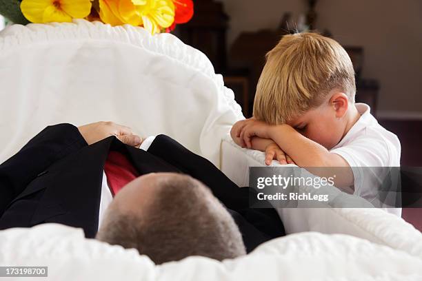 grieving little boy - coffin stockfoto's en -beelden