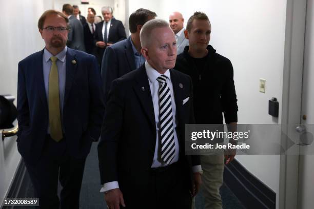 Rep. Chuck Edwards , Rep. Jeff Van Drew and Rep. Max Miller leave a House Republican caucus meeting at the U.S. Capitol on October 12, 2023 in...