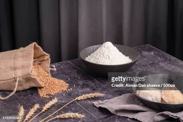 close-up of flour in bowl on table - oat ear stock pictures, royalty-free photos & images