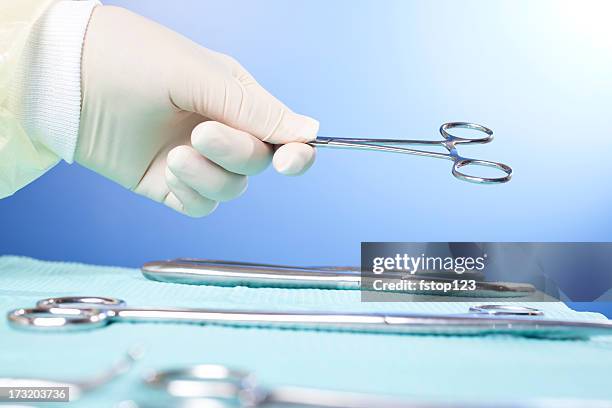 medical personnel with surgery instruments - surgical tray stock pictures, royalty-free photos & images