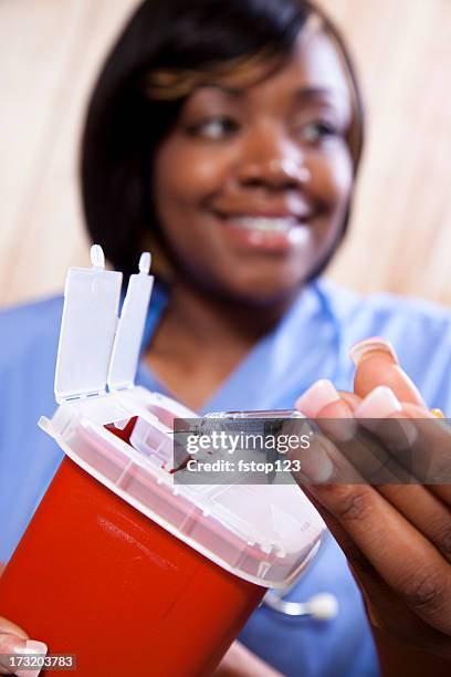 nurse demonstrating proper disposal of medications - behållare för farligt avfall bildbanksfoton och bilder