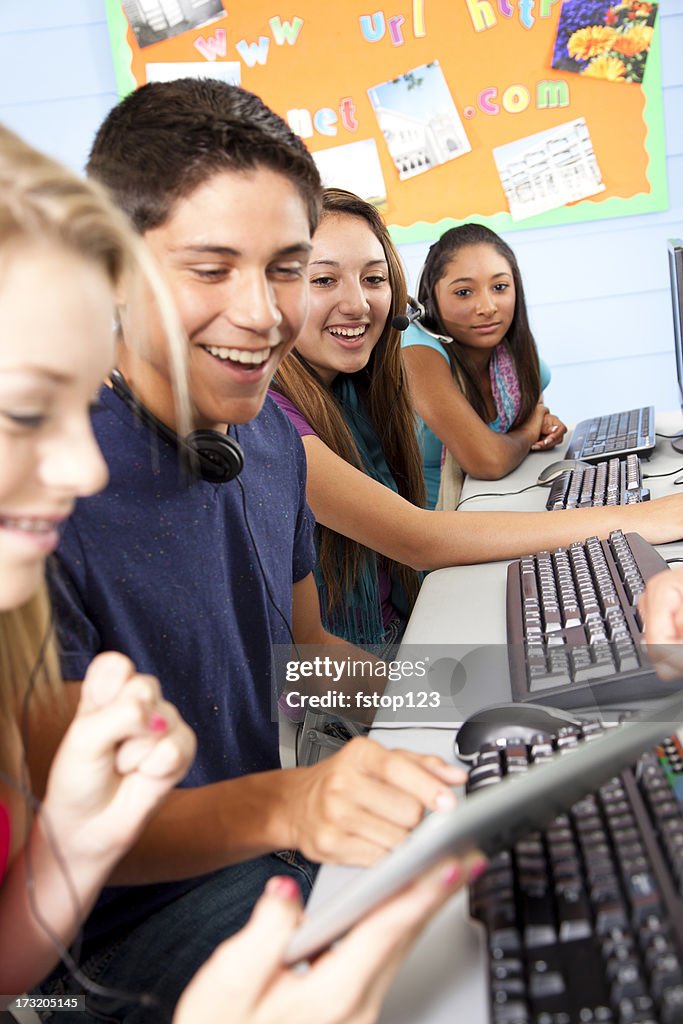 High School students in computer lab classroom. Digital tablet.