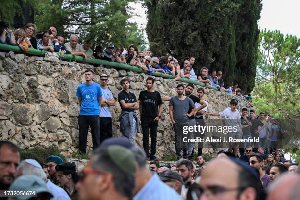 Family and friends mourn the death of Valentin Ghnassia originally from France, who was killed in a battle with Palestinian militants at Kibbutz...