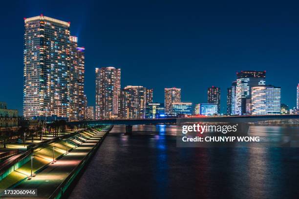 night view of shin-toyosu and harumi bridge in tokyo - chuo ward tokyo stock pictures, royalty-free photos & images