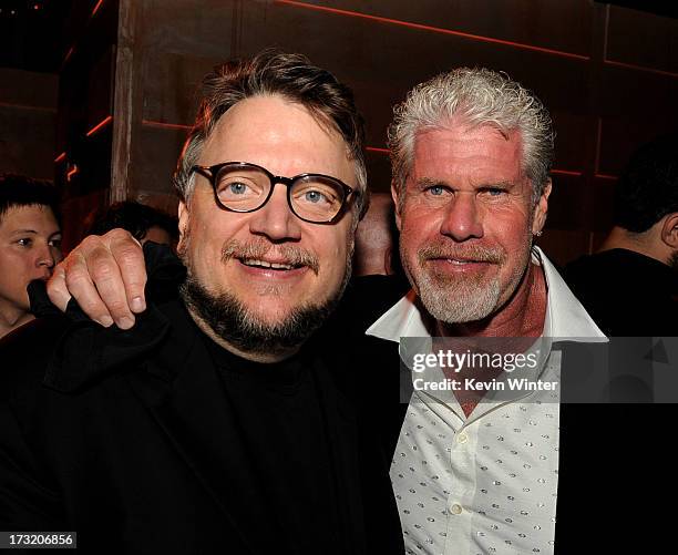 Director Guillermo del Toro and actor Ron Perlman pose at the after party for the premiere of Warner Bros. Pictures and Legendary Pictures' "Pacific...