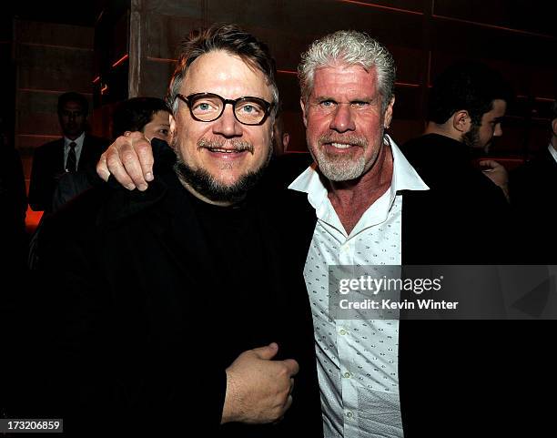 Director Guillermo del Toro and actor Ron Perlman pose at the after party for the premiere of Warner Bros. Pictures and Legendary Pictures' "Pacific...