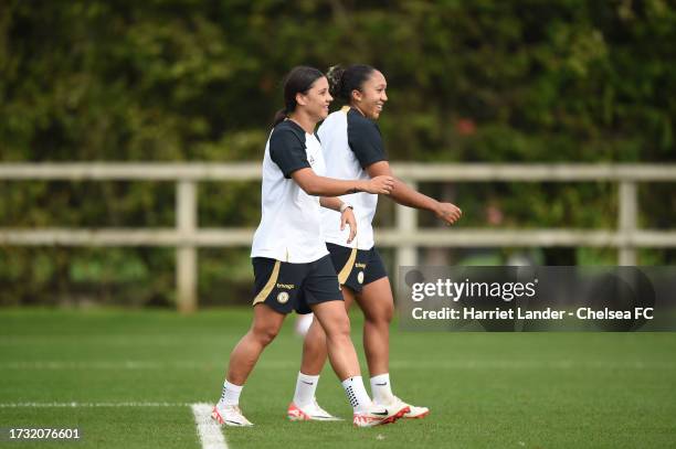 Lauren James and Sam Kerr of Chelsea react during a Chelsea FC Women's Training Session at Chelsea Training Ground on October 11, 2023 in Cobham,...