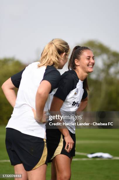 Erin Cuthbert and Eve Perisset of Chelsea react during a Chelsea FC Women's Training Session at Chelsea Training Ground on October 11, 2023 in...