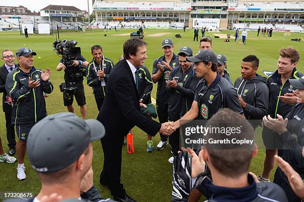 Ashton Agar of Australia receives his Baggy Green cap on his Test debut from former Australian fast bowler Glenn McGrath prior to day one of the 1st...