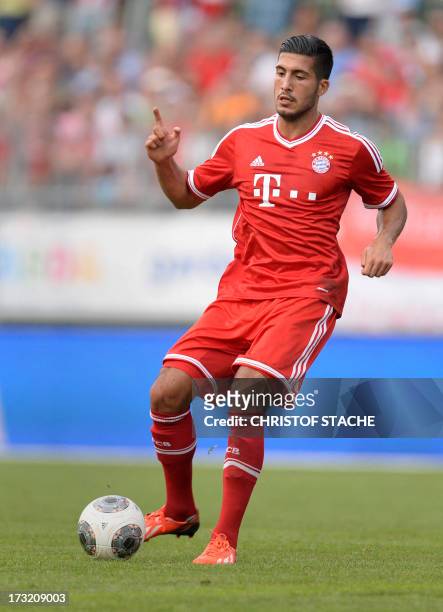 German Bundesliga first division football club FC Bayern Munich's midfielder Emre Can kicks the ball during a test match between FC Bayern Munich and...