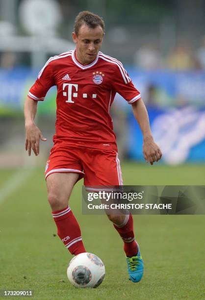 German Bundesliga first division football club FC Bayern Munich's Brazil defender Rafinha kicks the ball during a test match between FC Bayern Munich...