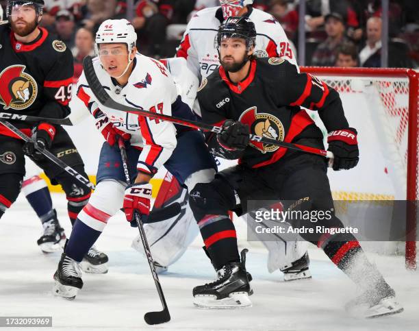 Mark Kastelic of the Ottawa Senators battles for position against Beck Malenstyn of the Washington Capitals at Canadian Tire Centre on October 18,...