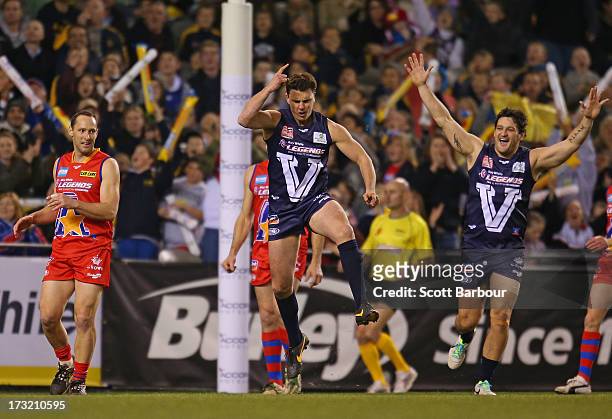 Matthew Lloyd of Victoria celebrates after kicking a goal during the EJ Whitten Legends AFL game between Victoria and the All Stars at Etihad Stadium...
