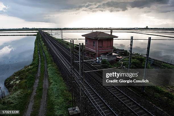 May 2: General view of a railroad crossing flooded rice fields at sunset on May 2, 2013 in Novara, Italy. With a production of over 40 million tons,...