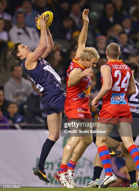 Matthew Lloyd of Victoria takes a mark during the EJ Whitten Legends AFL game between Victoria and the All Stars at Etihad Stadium on July 10, 2013...