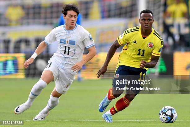 Jhon Arias of Colombia battles for possession with Facundo Pellistri of Uruguay during a FIFA World Cup 2026 Qualifier match between Colombia and...