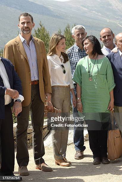 Prince Felipe of Spain and Princess Letizia of Spain pose for a group picture during their visit to Sierra de Guadarrama National Park on July 10,...