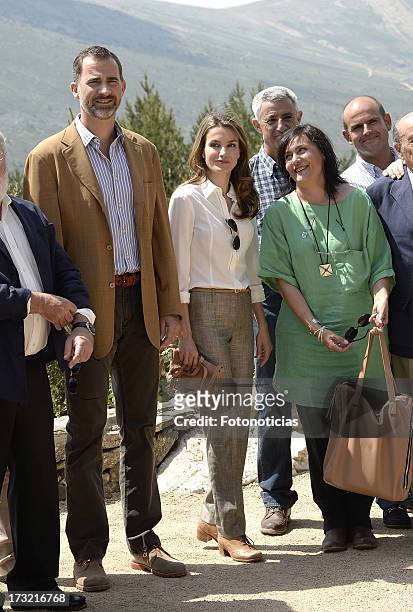 Prince Felipe of Spain and Princess Letizia of Spain pose for a group picture during their visit to Sierra de Guadarrama National Park on July 10,...