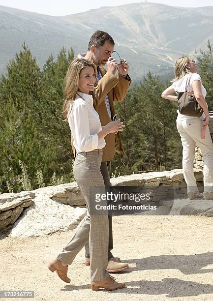 Prince Felipe of Spain and Princess Letizia of Spain visit Sierra de Guadarrama National Park on July 10, 2013 in Rascafria, Spain.