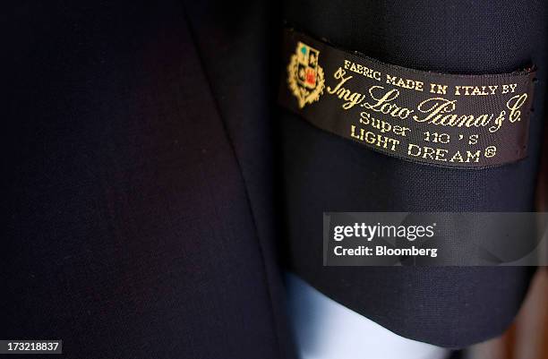 Made In Italy" label sits on the arm of a jacket in the window display of a Loro Piana SpA luxury cashmere store in Rome, Italy, on Wednesday, July...