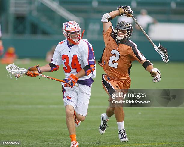 Martin Cahill of the Hamilton Nationals attacks against Dan Groot of the Rochester Rattlers at Sahlen's Stadium on July 7, 2013 in Rochester...