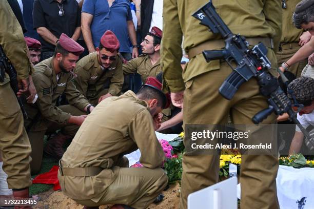 Fellow soldiers of Valentin Ghnassia who was killed in a battle with Palestinian militants at Kibbutz Be’eeri near the Israeli border with the Gaza...