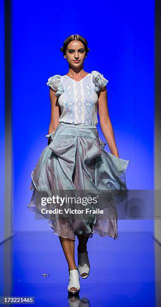 Model showcases designs of Nega C on the runway during the Designer Collection Show on day 2 of Hong Kong Fashion Week Spring/Summer 2013 at the Hong...