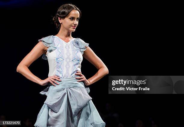 Model showcases designs of Nega C on the runway during the Designer Collection Show on day 2 of Hong Kong Fashion Week Spring/Summer 2013 at the Hong...