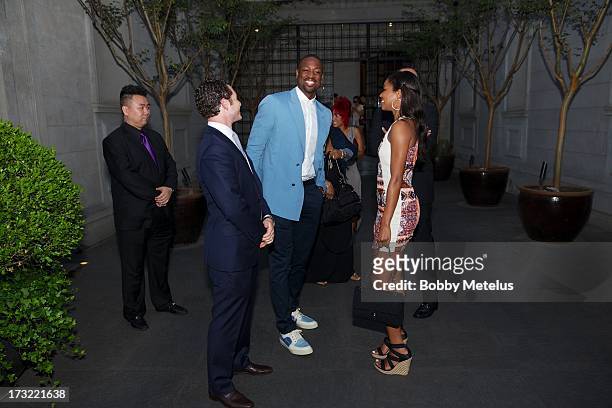 Dwyane Wade and Gabrielle Union with Director of Hotel Operations Michael Talansky during the SLS Hotels China Brand Launch at the Key Club on July...