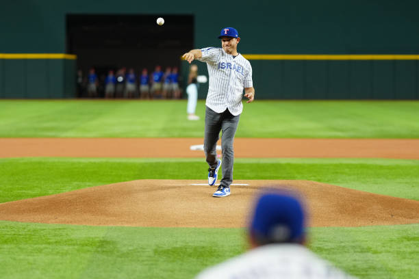 Texas Rangers alumni Ian Kinsler throws the ceremonial first pitch prior to Game 3 of the ALCS between the Houston Astros and the Texas Rangers at...