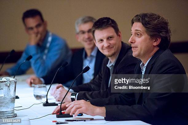 Dave Mathews, chief executive officer and founder of NewAer Inc., right, speaks as Jef Holove, chief executive officer of Basis Point, second right,...