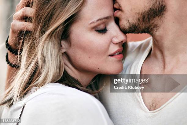 young couple in love - young couple kissing desire blond stock pictures, royalty-free photos & images