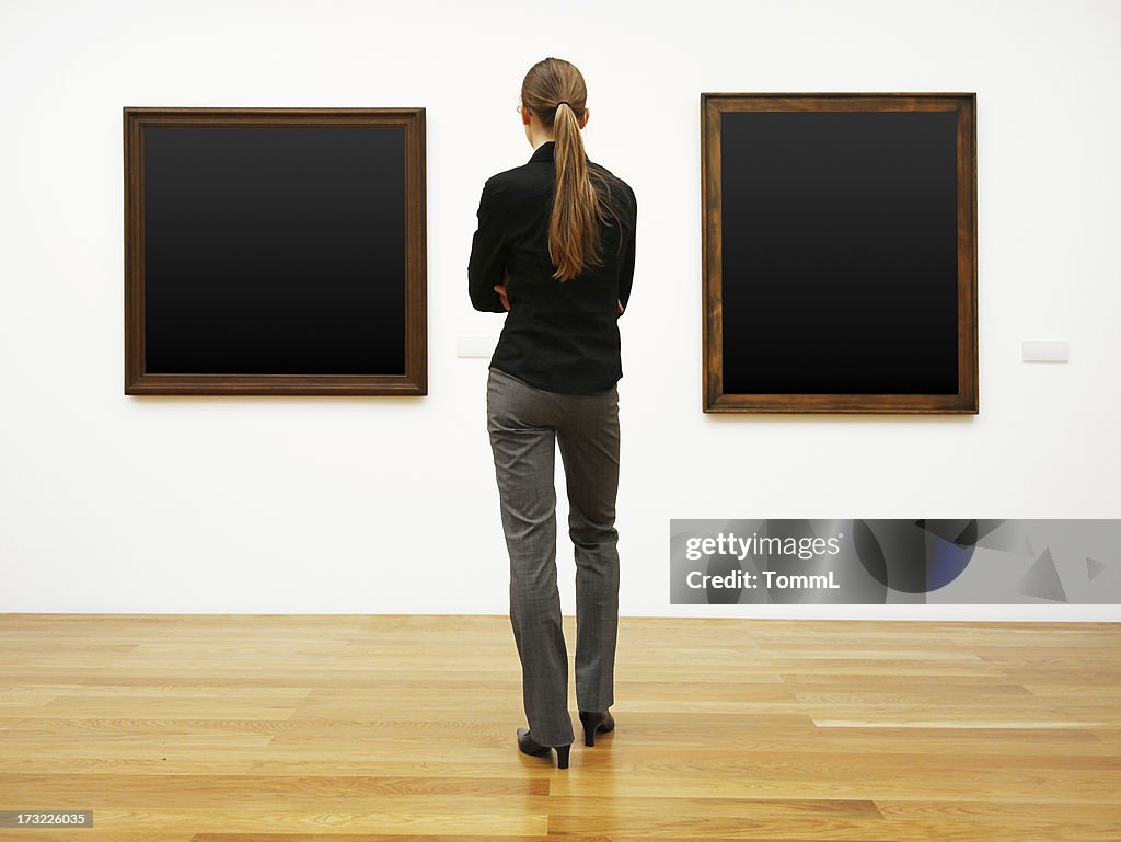 Woman in a gallery (clipping path)