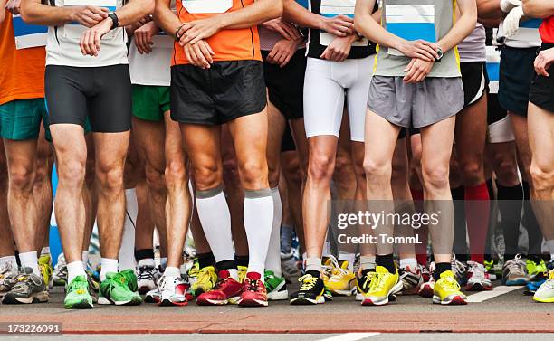 it takes all kinds to help finish the race - marathon stock pictures, royalty-free photos & images