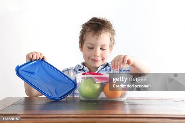 Tupperware Box Opening A Boy Opens A Tupperware Box With An Apple And Orange Inside High-Res ...