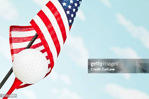 american flag with white golf ball on red tee - american golf stock pictures, royalty-free photos & images