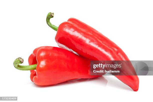 red peppers isolated on white background - bell peppers stock pictures, royalty-free photos & images