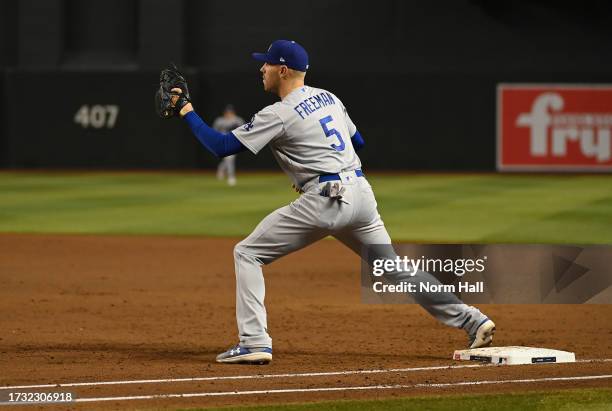 Freddie Freeman of the Los Angeles Dodgers gets ready to make a play against the Arizona Diamondbacks during Game Three of the Division Series at...